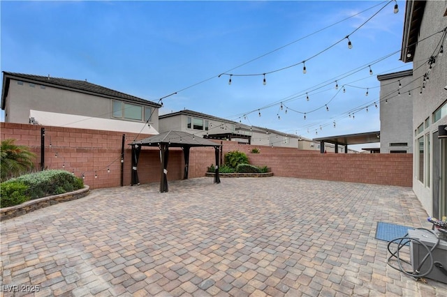 view of patio / terrace featuring a gazebo and a fenced backyard