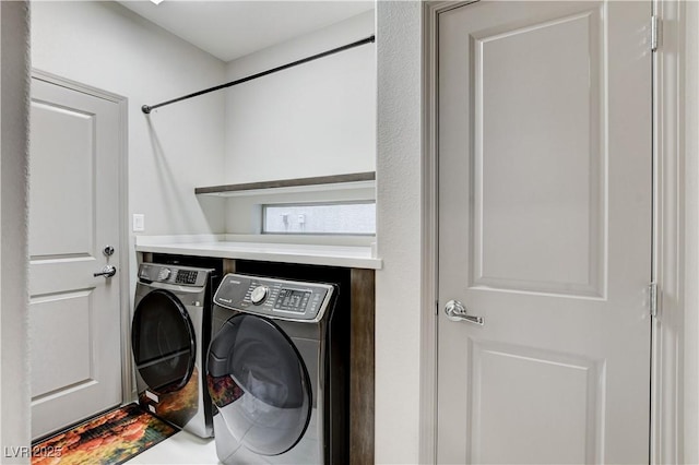 laundry area featuring laundry area and washing machine and dryer