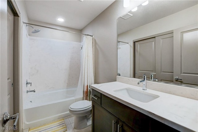 bathroom with visible vents, toilet, tile patterned flooring, shower / bath combo with shower curtain, and vanity