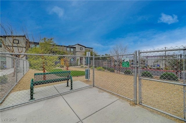 surrounding community featuring a gate and fence