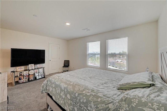 carpeted bedroom with visible vents