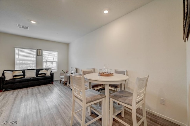 dining area featuring recessed lighting, visible vents, baseboards, and wood finished floors