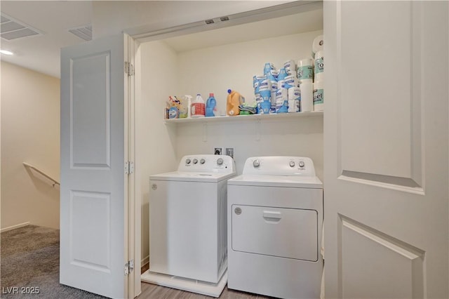 laundry room featuring laundry area, visible vents, and separate washer and dryer