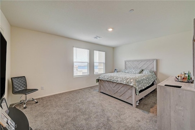 bedroom with carpet, visible vents, and baseboards