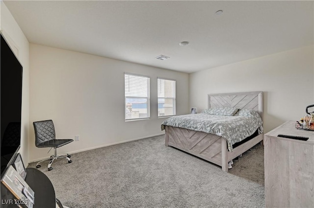 carpeted bedroom with visible vents and baseboards