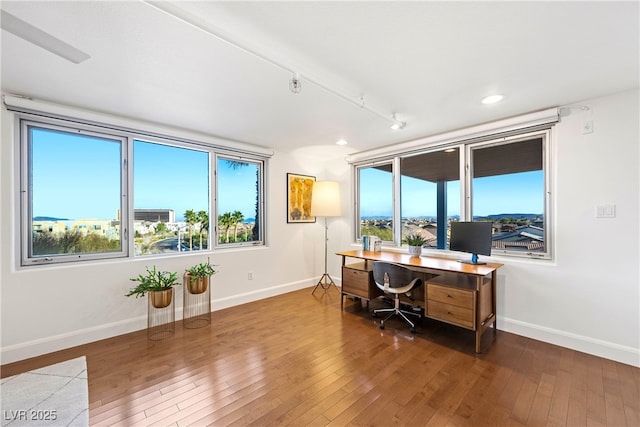 office featuring recessed lighting, baseboards, and hardwood / wood-style flooring