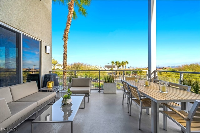 view of patio featuring outdoor lounge area and a balcony