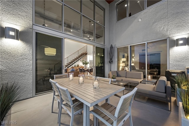 view of patio / terrace featuring outdoor dining area and an outdoor hangout area