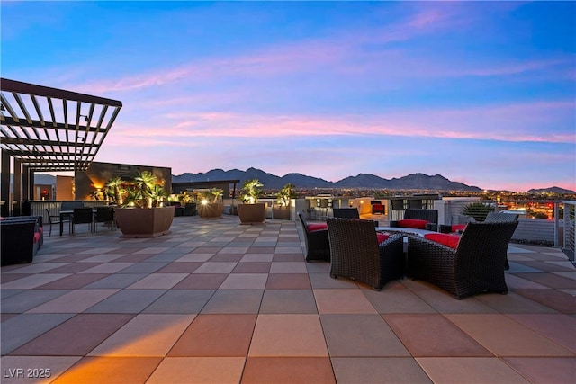 view of patio / terrace with a mountain view and a pergola