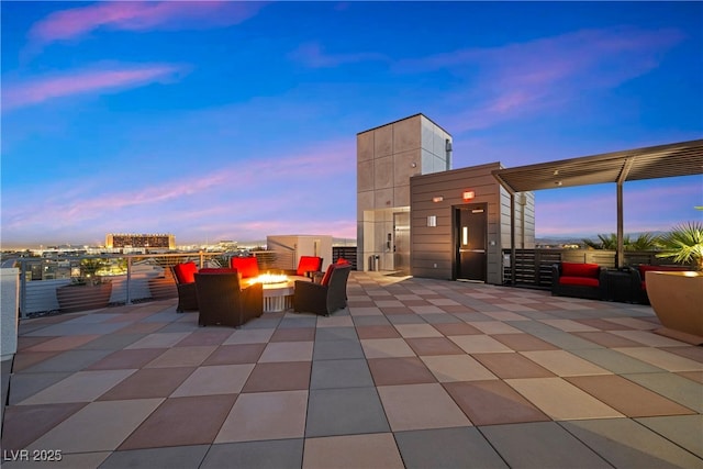 patio terrace at dusk with an outdoor fire pit