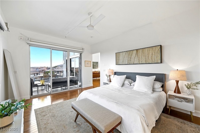 bedroom with access to outside, hardwood / wood-style floors, a ceiling fan, and baseboards