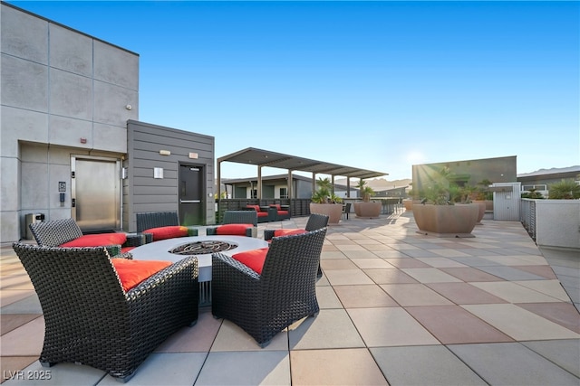 view of patio with an outdoor fire pit