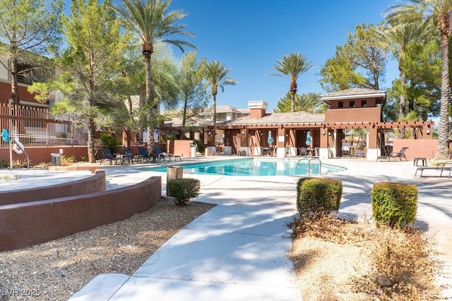 community pool with a patio area