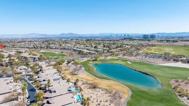 aerial view with golf course view and a water and mountain view