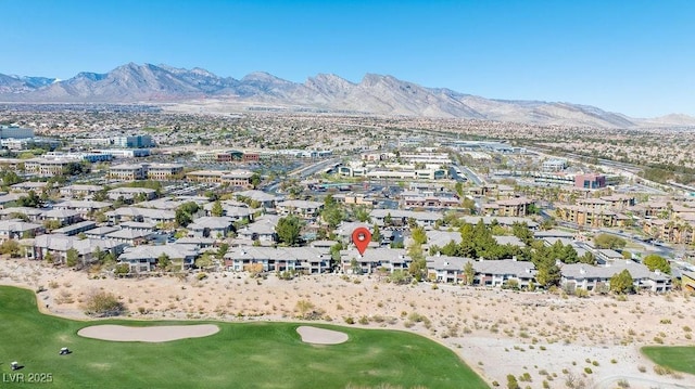 birds eye view of property featuring view of golf course, a mountain view, and a residential view