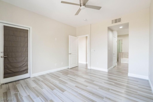 unfurnished room with light wood-type flooring, visible vents, baseboards, and a ceiling fan