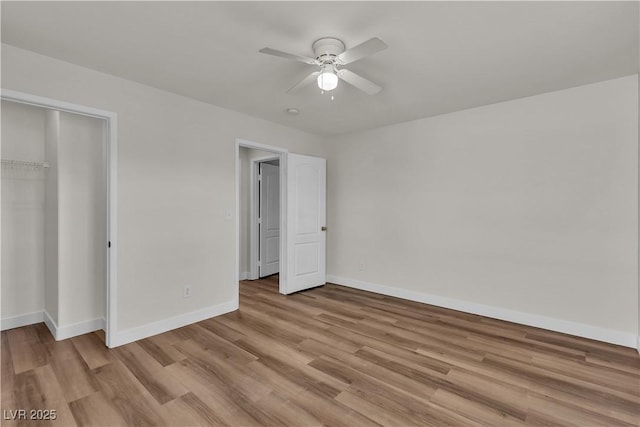 unfurnished bedroom featuring light wood-type flooring, baseboards, ceiling fan, and a closet