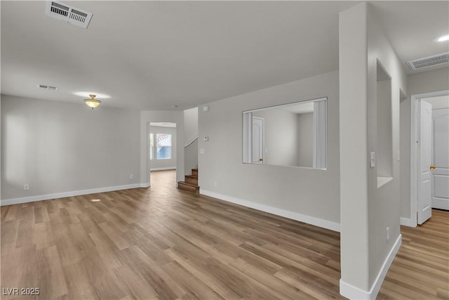 9526 Vast Valley Ave, Las Vegas, NV 89148 - unfurnished living room featuring wood finished floors, baseboards, and stairs