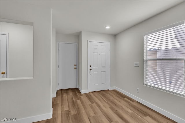 entrance foyer featuring recessed lighting, baseboards, and light wood-type flooring