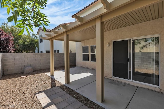 view of patio / terrace featuring fence