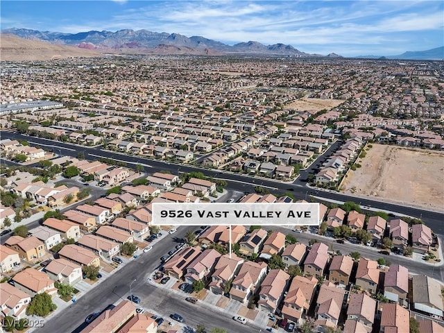 birds eye view of property featuring a mountain view and a residential view
