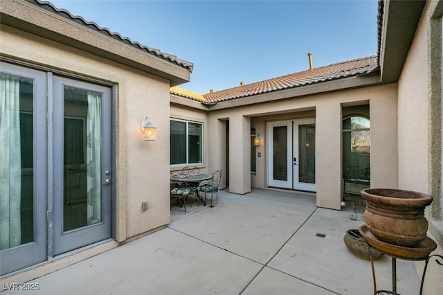 view of patio with french doors and outdoor dining area