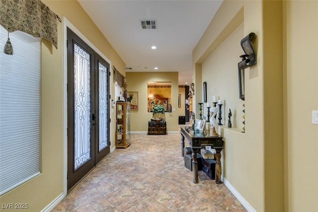 foyer entrance with french doors, recessed lighting, visible vents, and baseboards