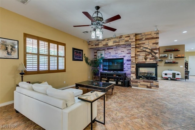 living room with baseboards, a fireplace, visible vents, and recessed lighting