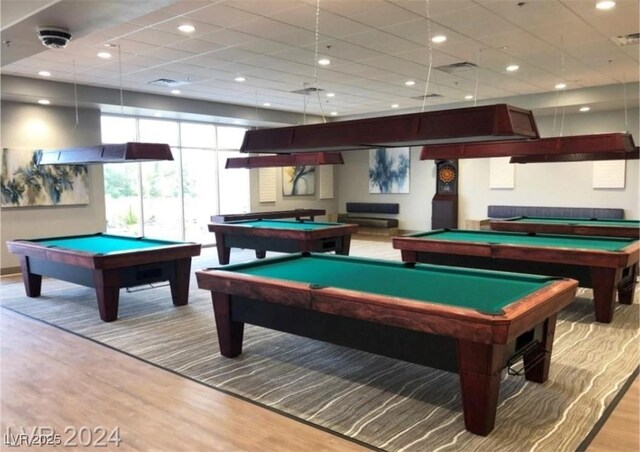 recreation room with a paneled ceiling, pool table, recessed lighting, and wood finished floors