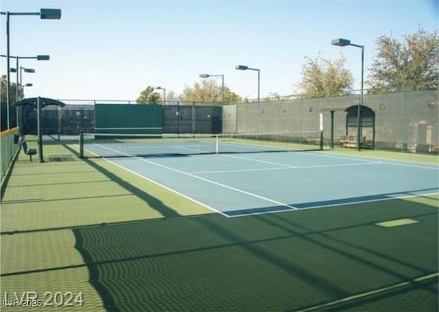 view of sport court featuring community basketball court and fence