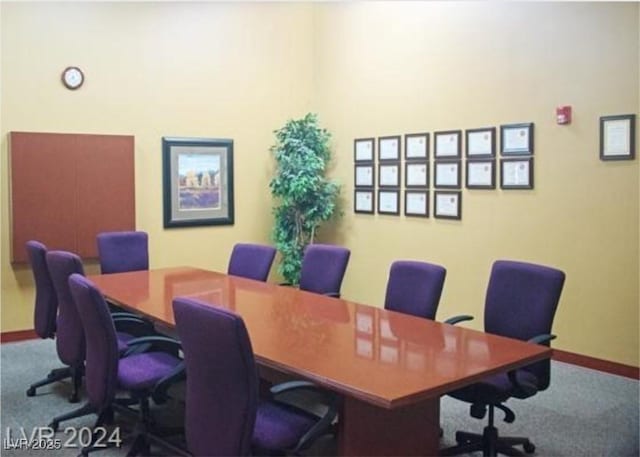 office space featuring carpet floors and baseboards