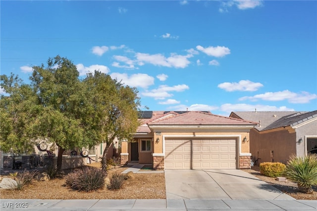 view of front of home featuring a tiled roof, stone siding, concrete driveway, and stucco siding