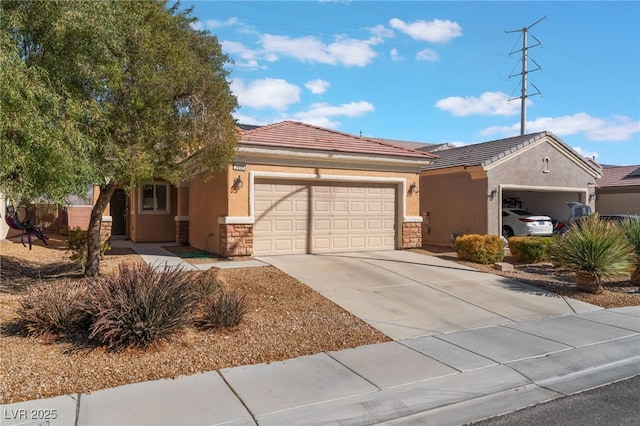 single story home with driveway, a garage, stone siding, a tile roof, and stucco siding