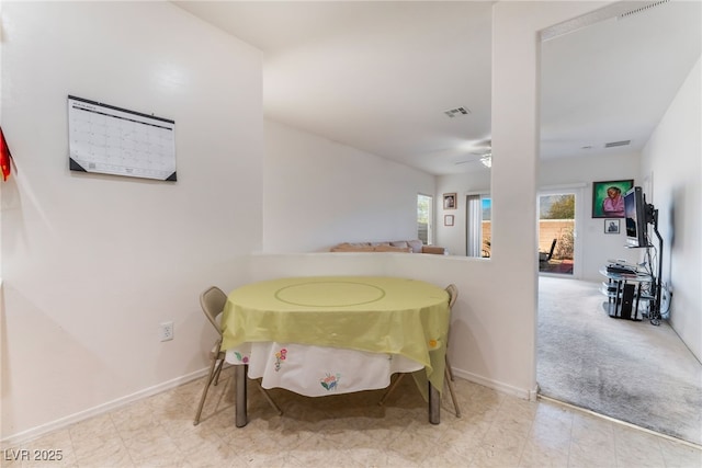 dining area featuring baseboards, visible vents, and a ceiling fan