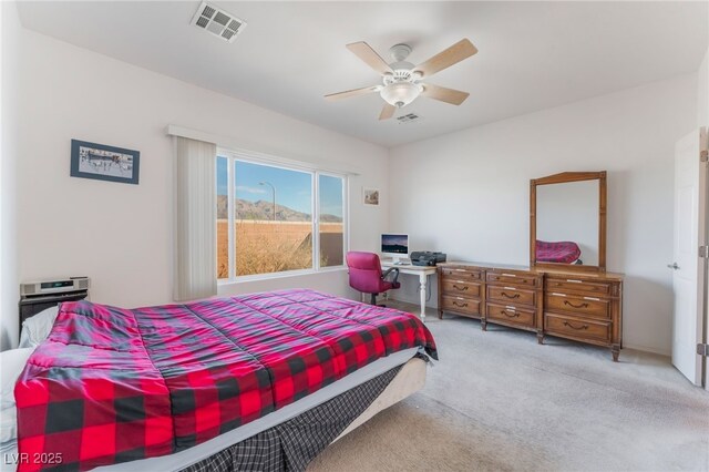 bedroom with carpet floors, visible vents, and a ceiling fan