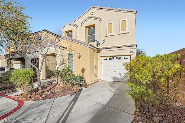 view of front of home featuring an attached garage, a tile roof, concrete driveway, and stucco siding