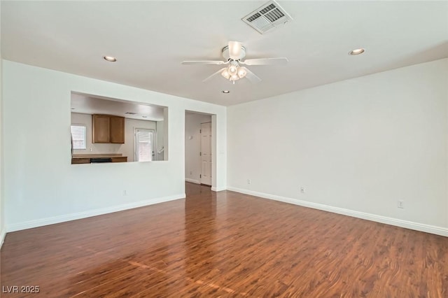 unfurnished living room with dark wood-type flooring, recessed lighting, visible vents, and baseboards