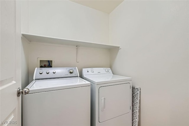 laundry area with laundry area and washer and clothes dryer