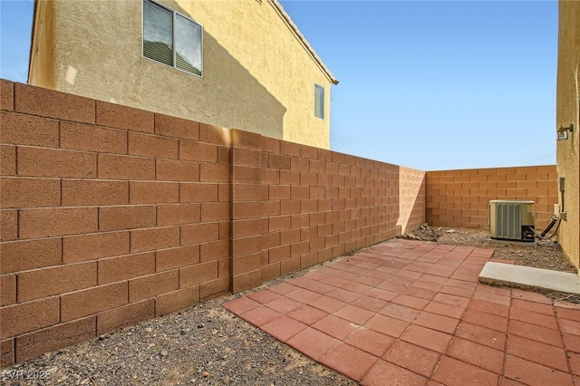 view of patio / terrace featuring central AC and a fenced backyard