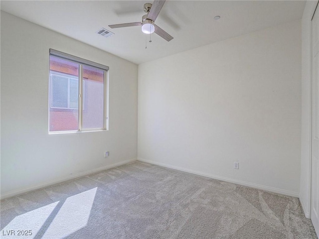 unfurnished room featuring light carpet, baseboards, and visible vents