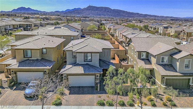 birds eye view of property featuring a mountain view and a residential view