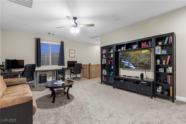 living room featuring carpet floors, visible vents, and a ceiling fan