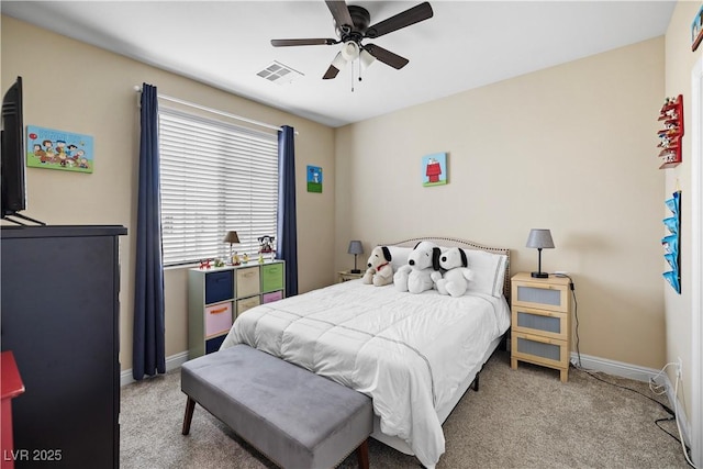 carpeted bedroom with a ceiling fan, visible vents, and baseboards