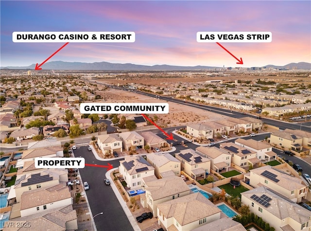 birds eye view of property featuring a residential view and a mountain view