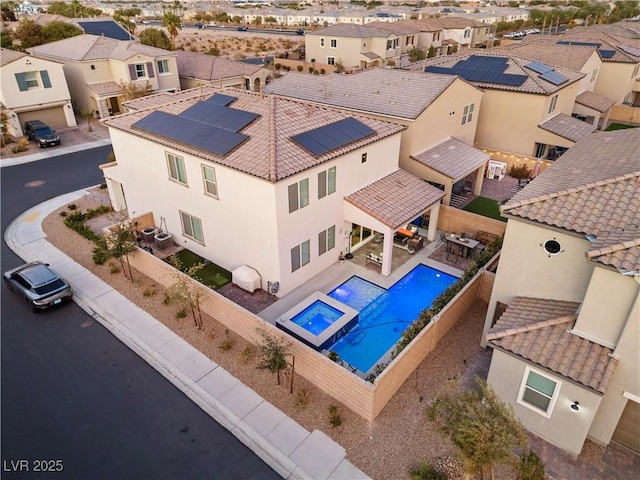 view of pool featuring a patio area, a fenced backyard, a residential view, and a fenced in pool