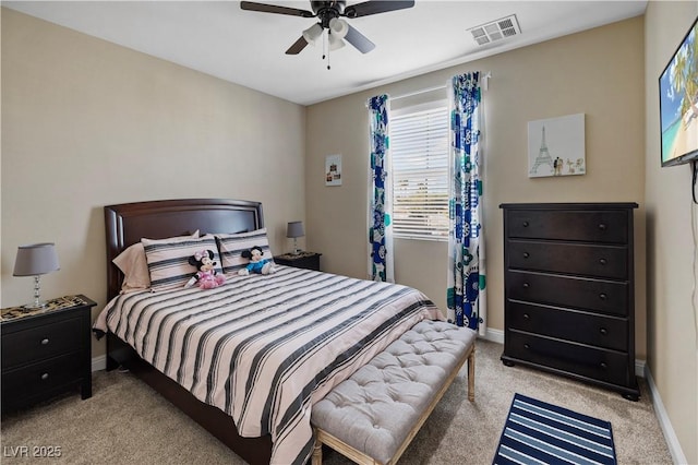 bedroom with baseboards, visible vents, a ceiling fan, and light colored carpet