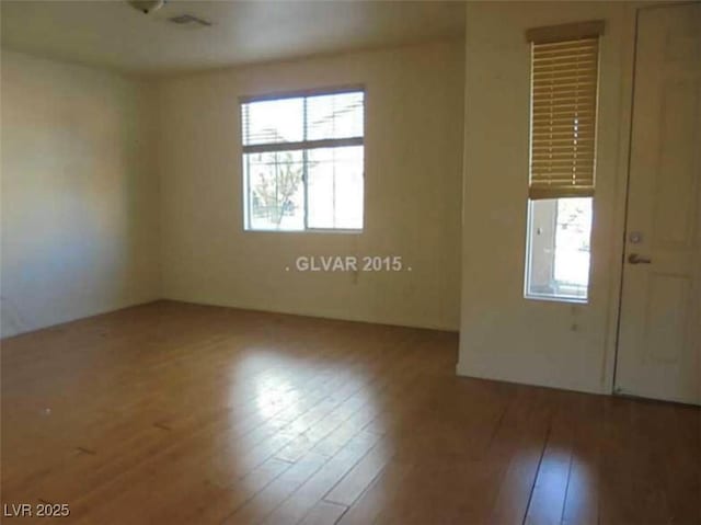 unfurnished room featuring wood finished floors