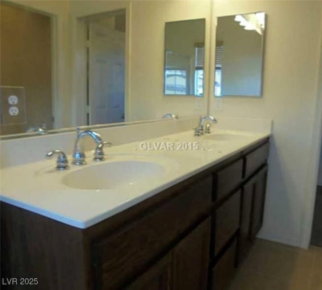 bathroom with double vanity and a sink