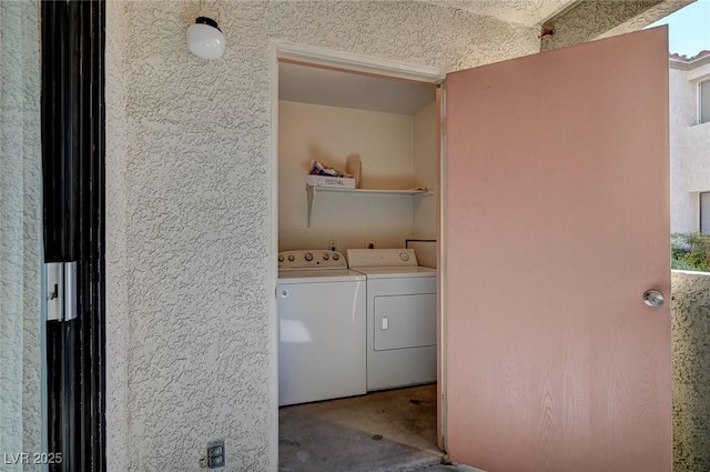 washroom with laundry area and independent washer and dryer