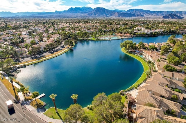 bird's eye view with a residential view and a water and mountain view